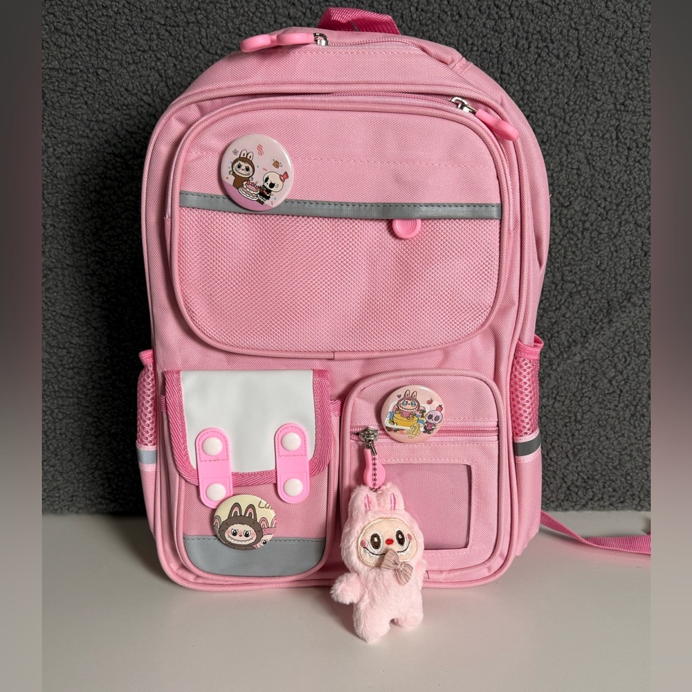 Pink Backpack with Cute Labubu Pins and Plush.